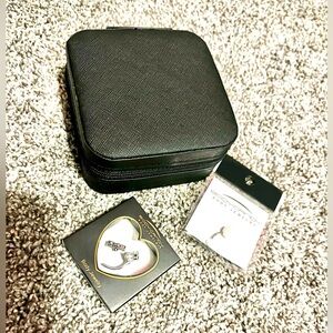 Two belly rings and carrying case brand new from body candy.